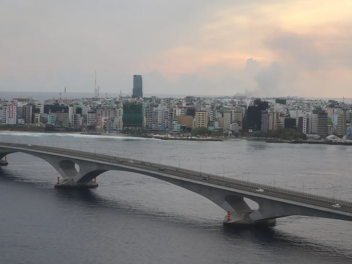Sinamal&eacute; Bridge crossing the sea toward the Malé city skyline